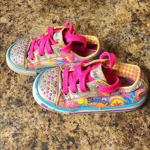 Toddler Skechers light up twinkle toes shoes.